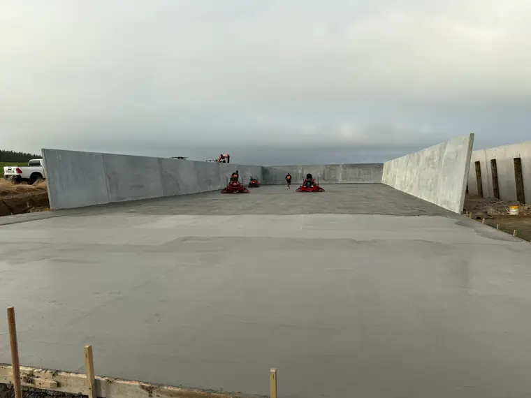Completed concrete floor running the full length of a precast silage bunker