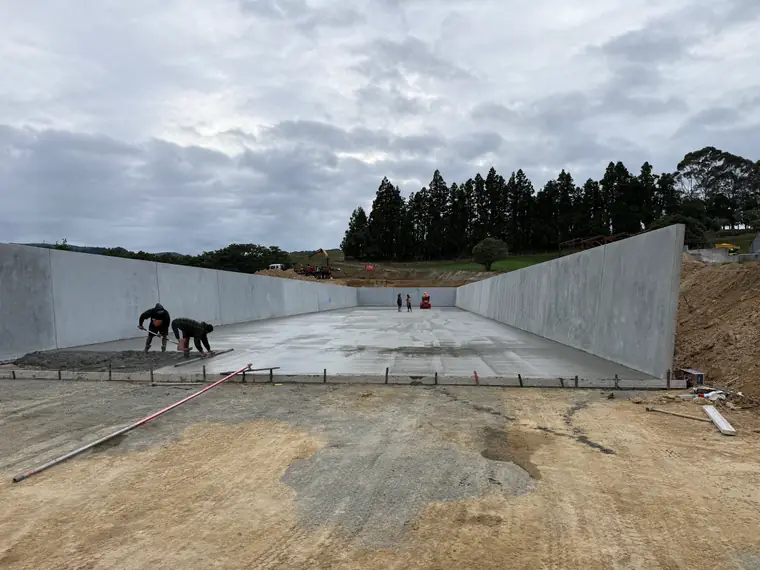 Two of the crew finishing the surface of a silage bunker floor