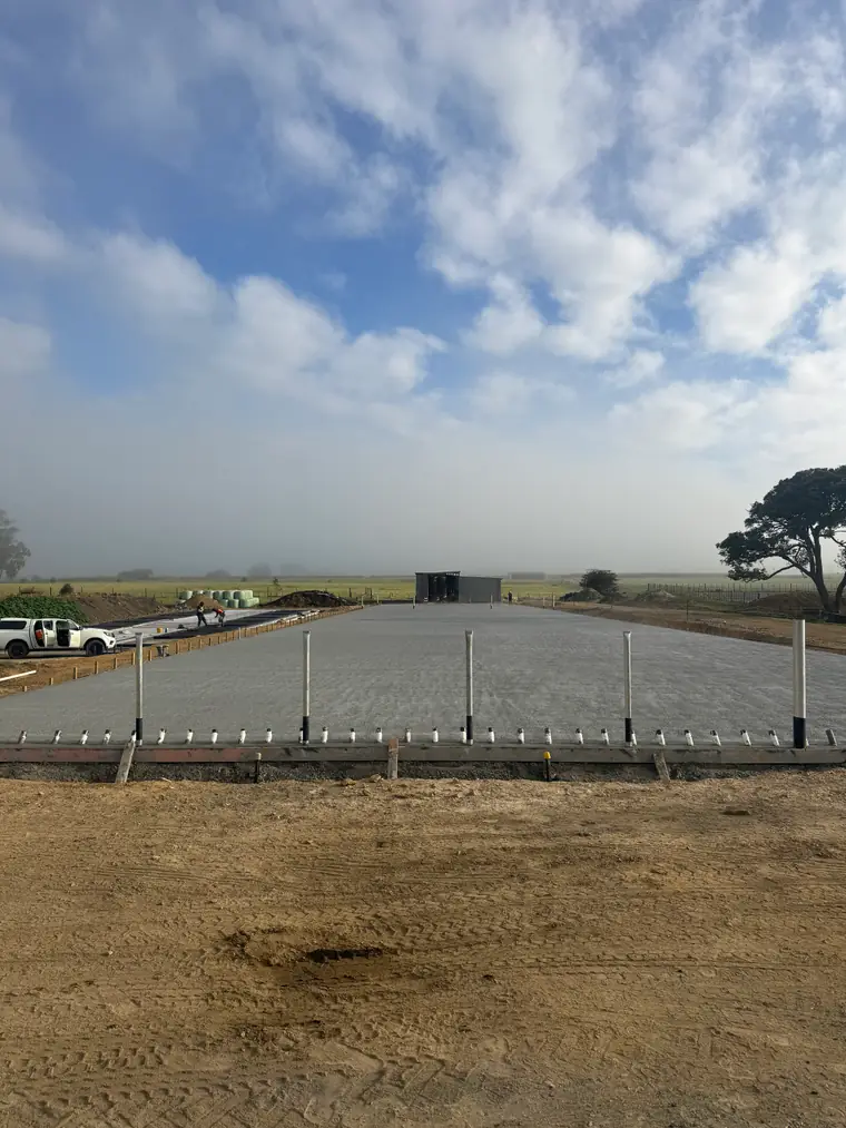 Freshly finished farm slab at dawn with the mist still sitting over the paddocks